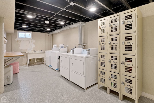 washroom with washing machine and clothes dryer