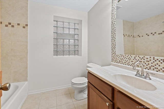 bathroom featuring tile patterned flooring, vanity, toilet, and backsplash