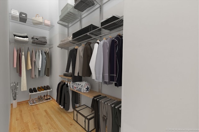 walk in closet featuring light hardwood / wood-style floors