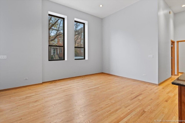 spare room with light wood-type flooring