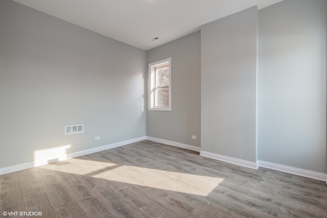 unfurnished room featuring light hardwood / wood-style floors