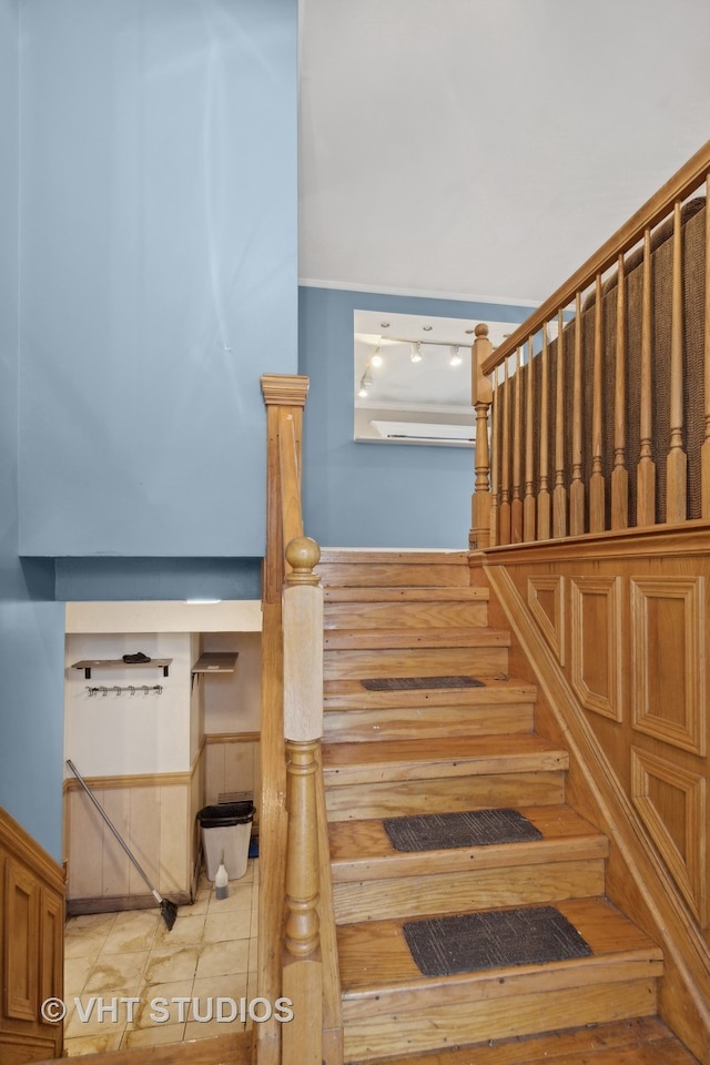 stairway featuring tile patterned floors