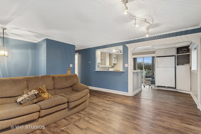 living room featuring wood-type flooring and crown molding