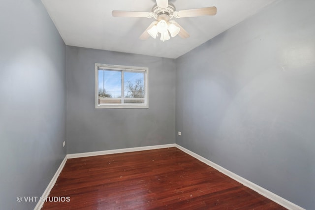 empty room with ceiling fan and hardwood / wood-style floors