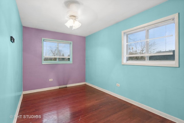 12416 S Trumbull Ave, Alsip, IL 60803 - unfurnished room featuring wood finished floors, baseboards, and a ceiling fan