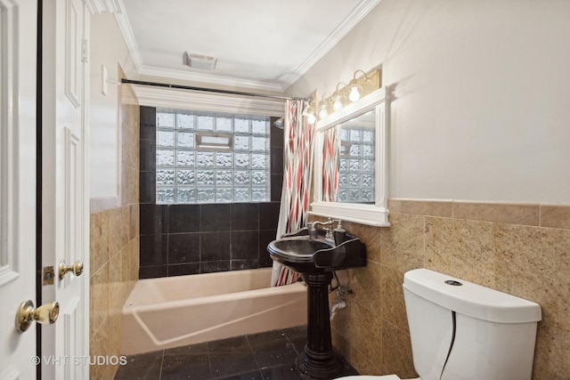 12416 S Trumbull Ave, Alsip, IL 60803 - full bath with tile walls, shower / bathtub combination with curtain, ornamental molding, toilet, and wainscoting
