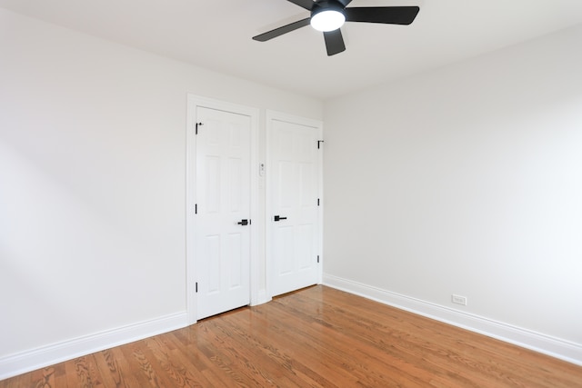 unfurnished bedroom with wood-type flooring and ceiling fan