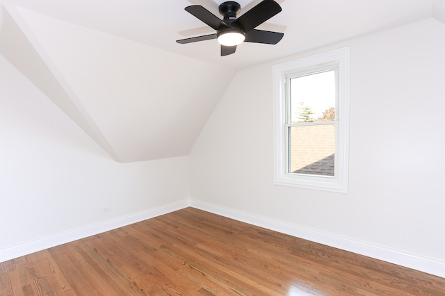 bonus room with hardwood / wood-style floors, vaulted ceiling, and ceiling fan