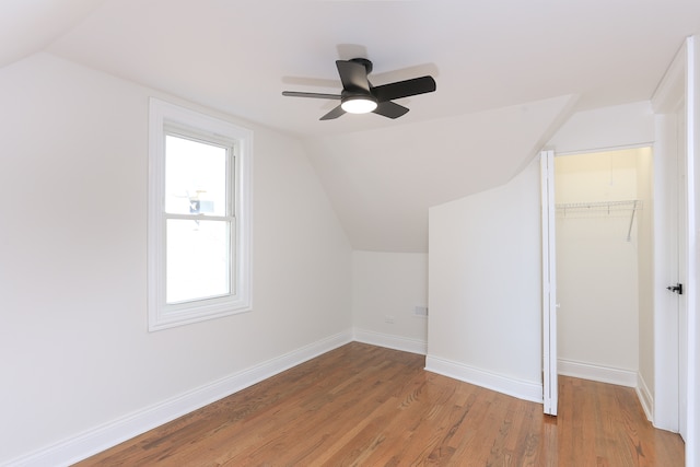 bonus room featuring hardwood / wood-style flooring, ceiling fan, and lofted ceiling