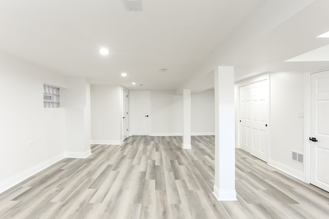 basement featuring light hardwood / wood-style flooring