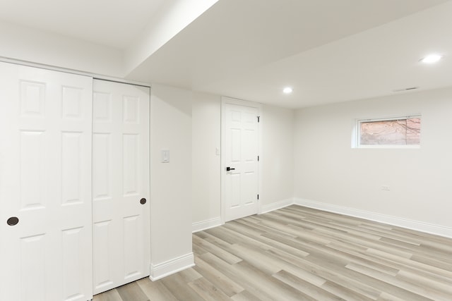 basement featuring light hardwood / wood-style floors