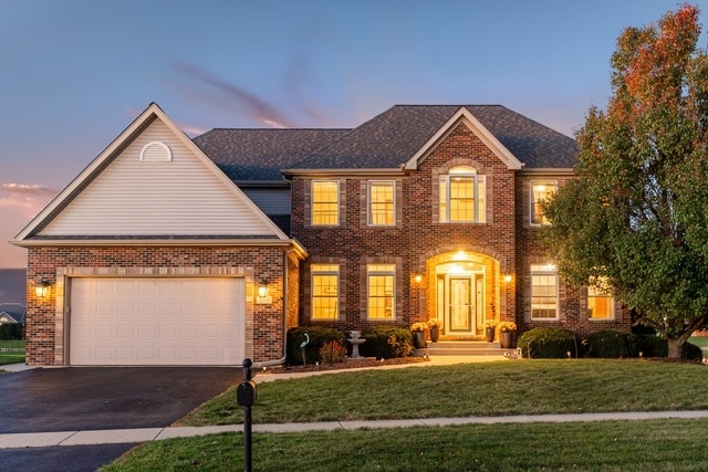 colonial-style house featuring a yard