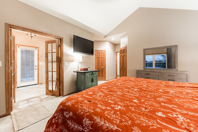 bedroom featuring a chandelier, french doors, light carpet, and vaulted ceiling