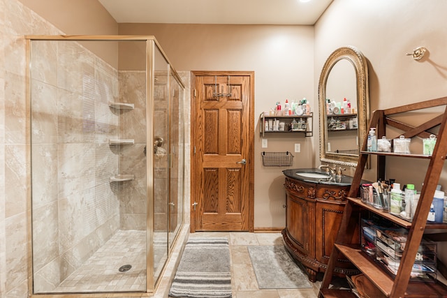 bathroom featuring vanity and a shower with shower door