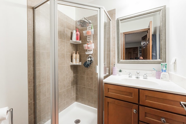 bathroom with vanity and walk in shower