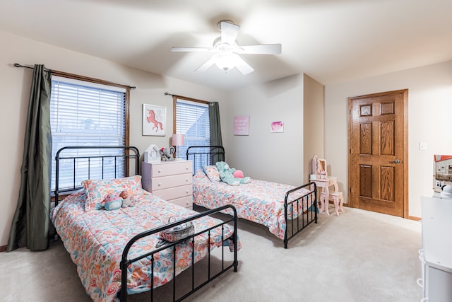 carpeted bedroom with ceiling fan