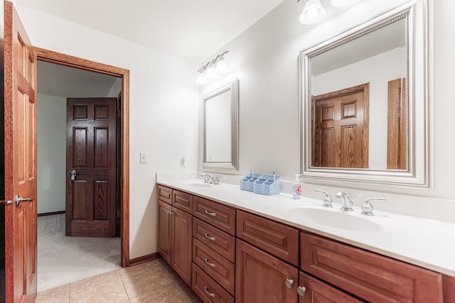 bathroom with tile patterned flooring and vanity