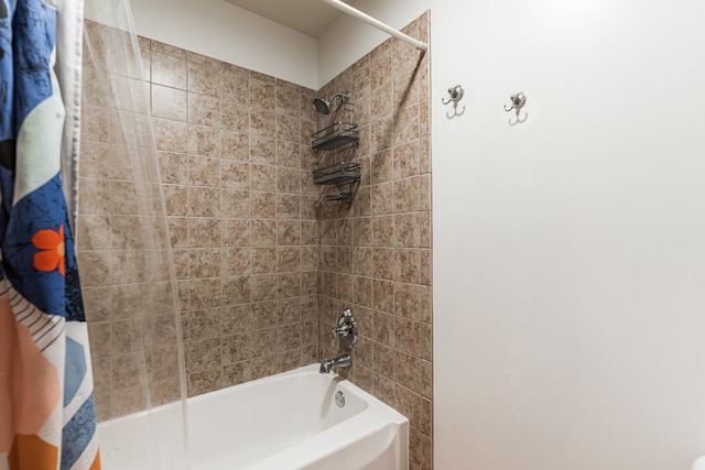 bathroom with shower / bath combination with curtain