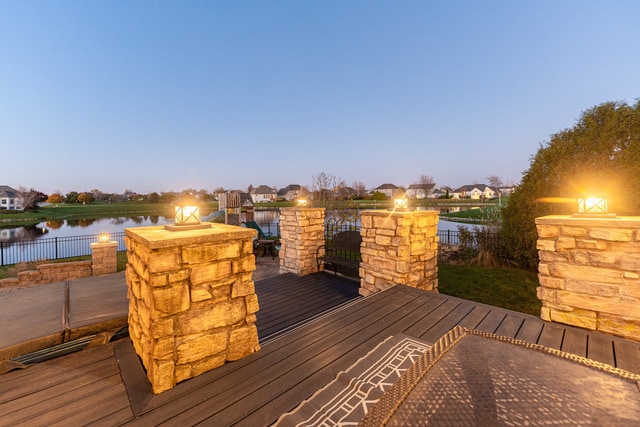 deck at dusk with a water view