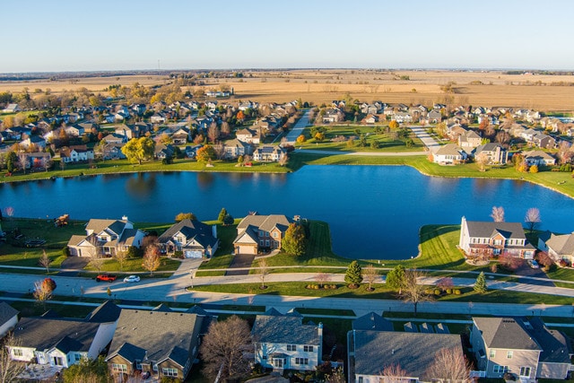 birds eye view of property featuring a water view