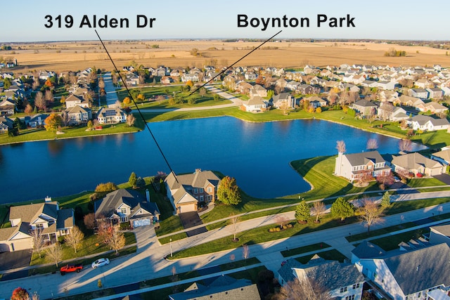 birds eye view of property with a water view