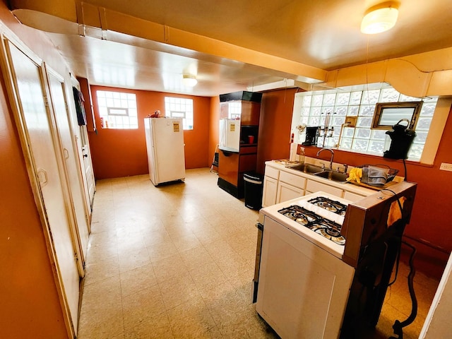 kitchen with white appliances and sink