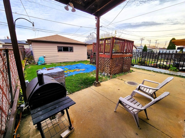 view of patio / terrace with an outbuilding and grilling area