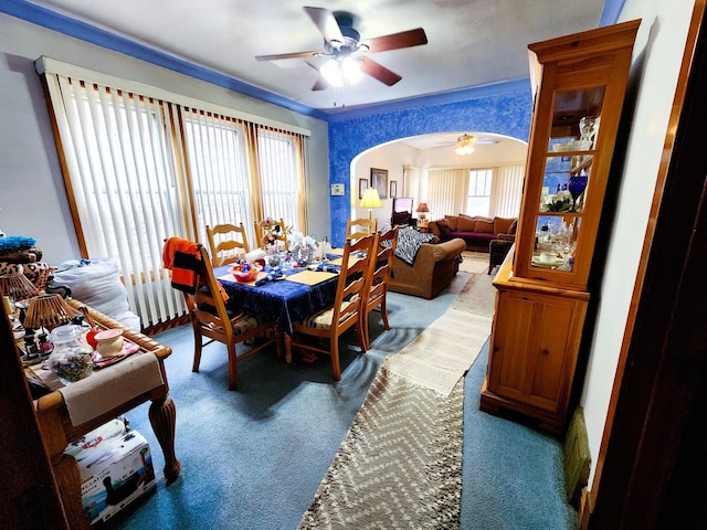 dining room featuring carpet flooring and ceiling fan