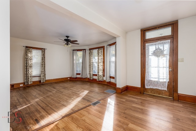 entryway with ceiling fan and light wood-type flooring