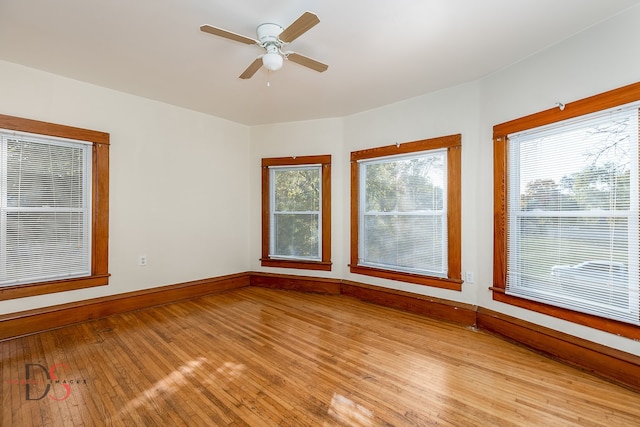 spare room featuring ceiling fan and light hardwood / wood-style floors