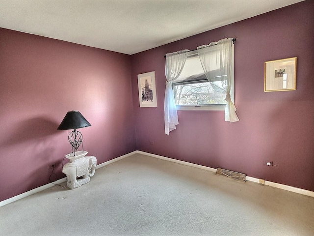 spare room featuring carpet flooring