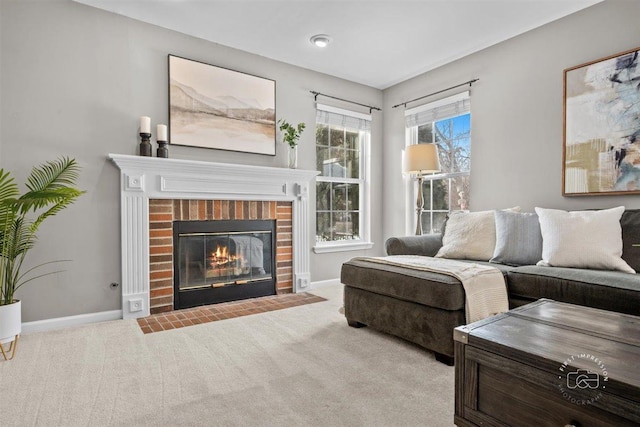 carpeted living room featuring a fireplace