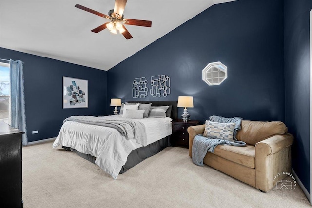 carpeted bedroom with high vaulted ceiling and ceiling fan