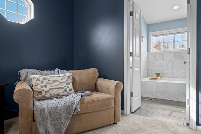 sitting room with light colored carpet