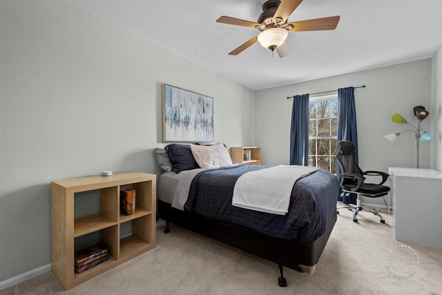 bedroom featuring light carpet and ceiling fan