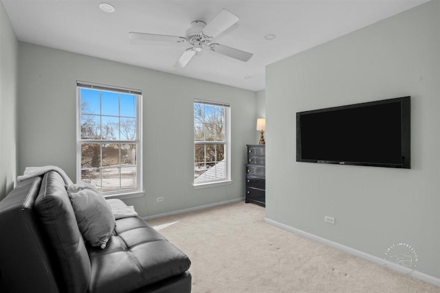 living room featuring ceiling fan and light carpet