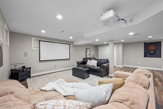 cinema room featuring hardwood / wood-style floors