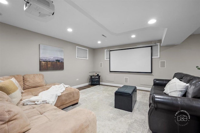 cinema featuring light hardwood / wood-style floors