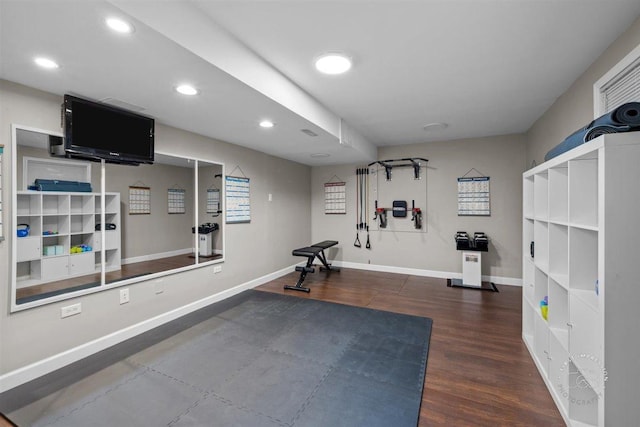 workout room featuring dark hardwood / wood-style flooring