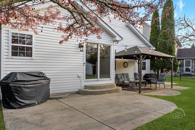 back of house with a gazebo and a patio area