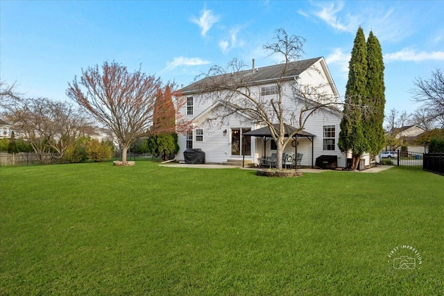 rear view of property featuring a patio area and a lawn