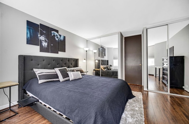 bedroom featuring dark hardwood / wood-style flooring