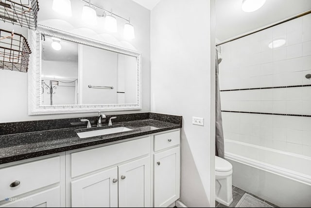 full bathroom featuring shower / bath combination with curtain, vanity, and toilet