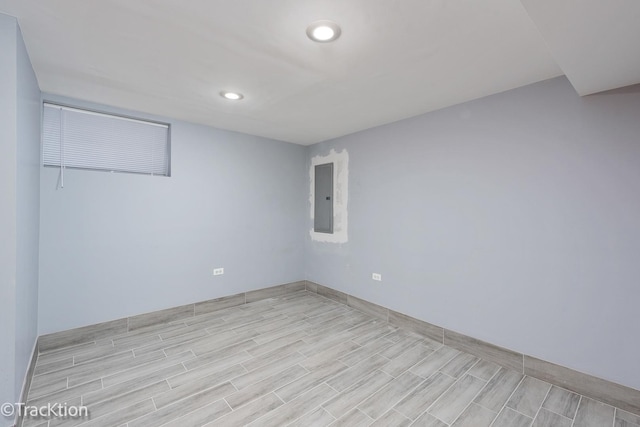 unfurnished room featuring electric panel