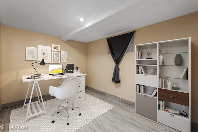 office featuring light hardwood / wood-style flooring and beamed ceiling