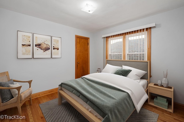 bedroom featuring wood-type flooring