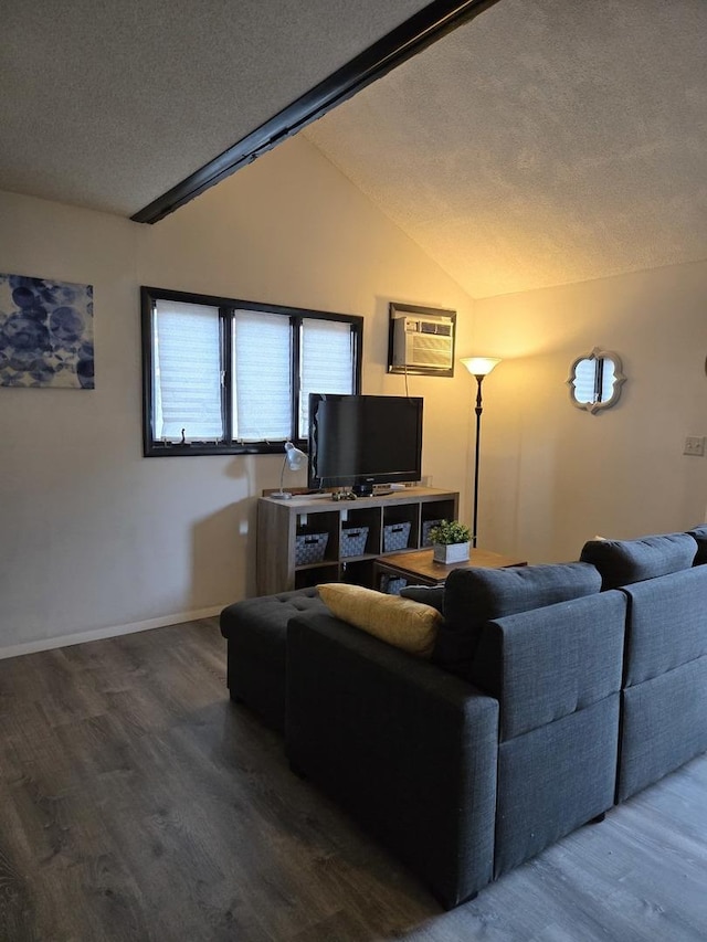 living room with a wall mounted air conditioner, lofted ceiling, a textured ceiling, and hardwood / wood-style flooring