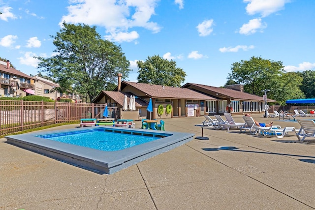 view of swimming pool featuring a patio