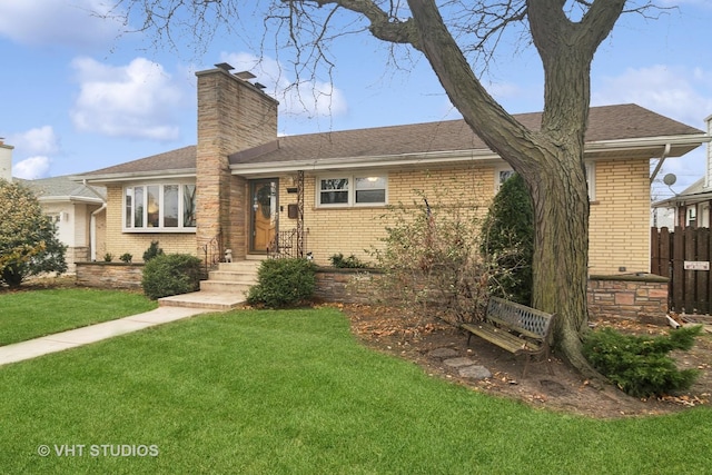 single story home featuring a front lawn