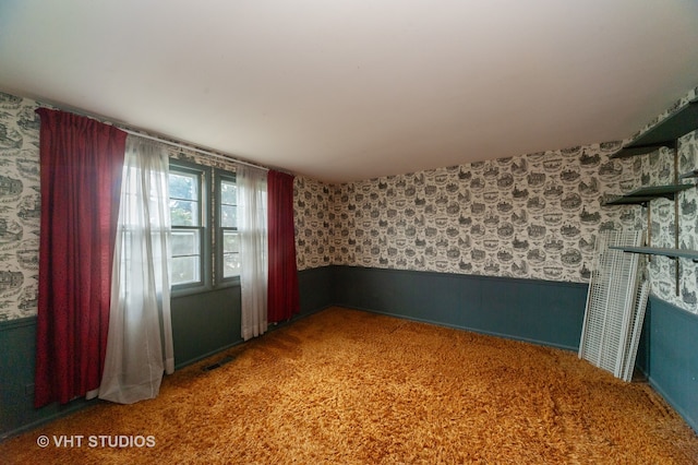 unfurnished room featuring carpet flooring